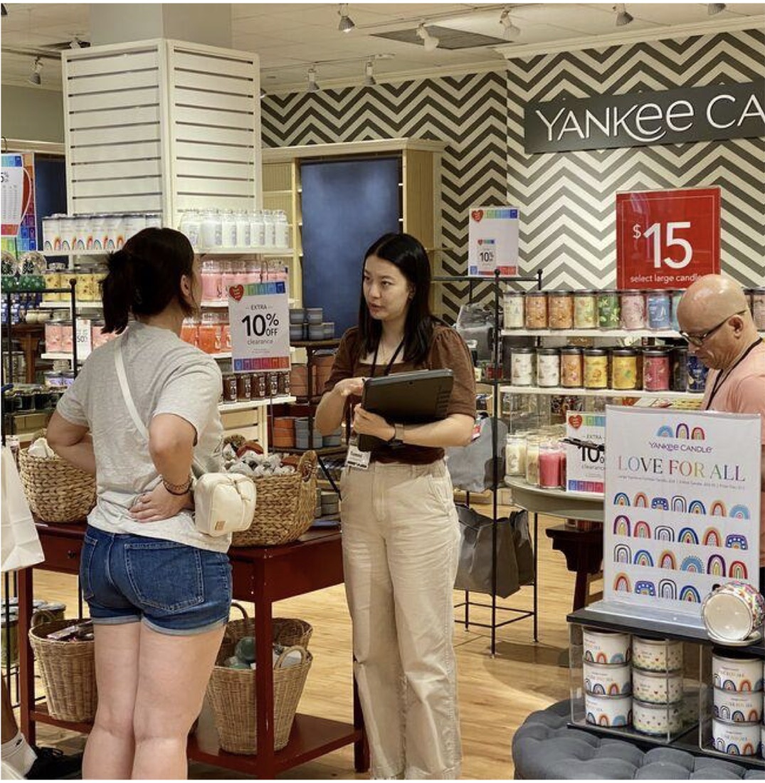 An interview with a shopper inside a Yankee Candle store